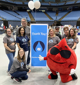 Committee members and Buddy the Blood Drop with a Thank you sign.